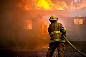 one firefighter putting out a fire by himself